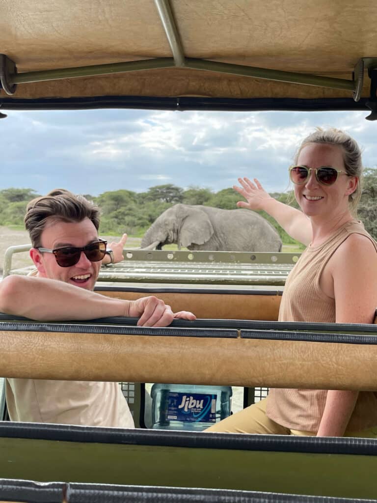 couple during a safari spots an elephant