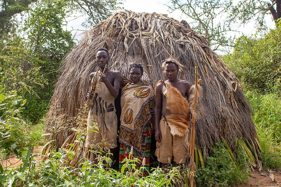 The Hadzabe people in front of their typical house