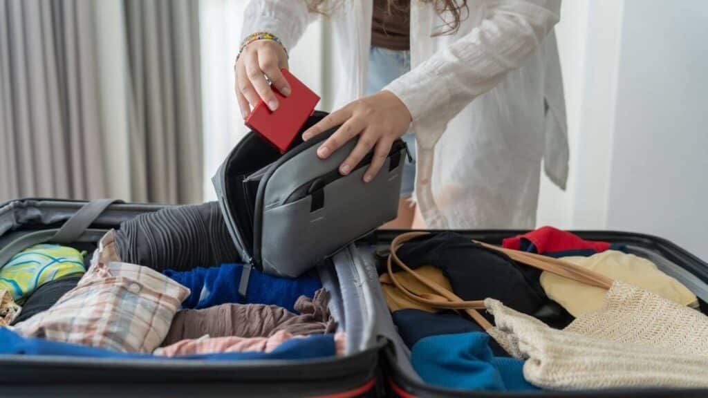 Woman packing her bag before leaving for a safari in Africa